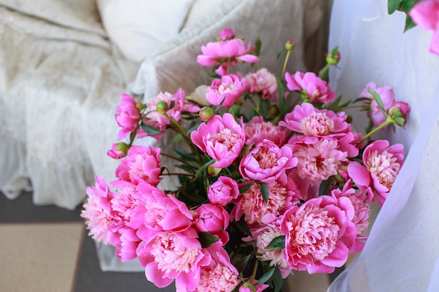 Beautiful wedding bouquet in bride's hand of white peonies