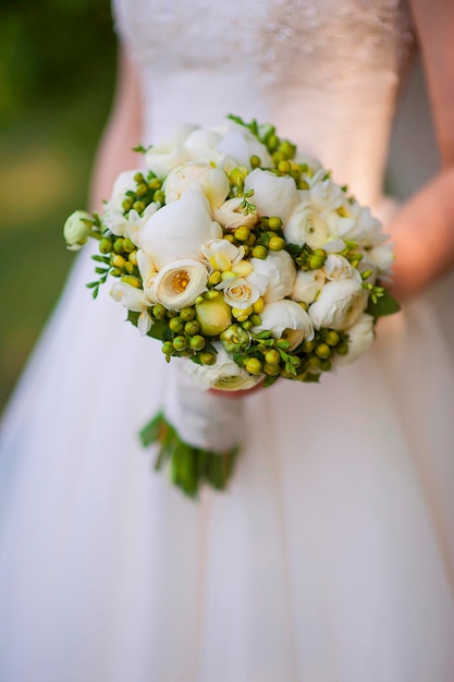 Beautiful wedding bouquet in bride39s hand