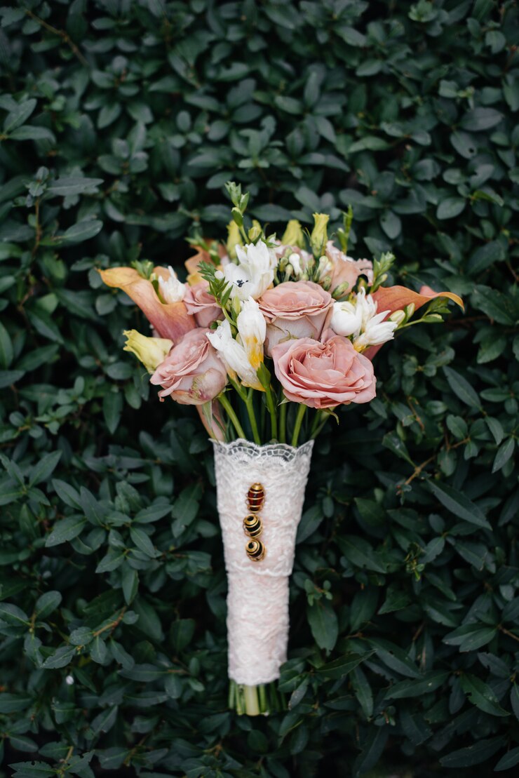 Beautiful wedding bouquet on the green grass on a summer day.
