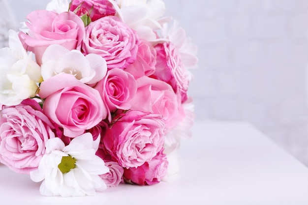 Beautiful wedding bouquet on grey wall background