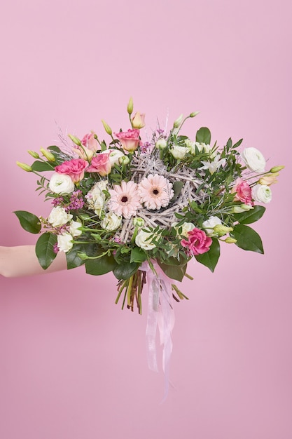 Beautiful wedding bouquet in hand delicate flowers