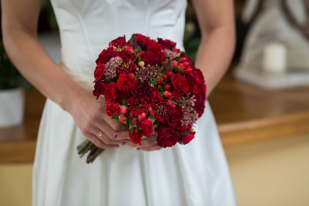 Beautiful wedding bouquet in hands of the bride