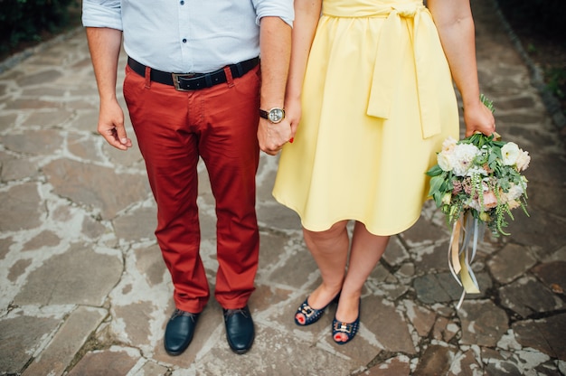 Beautiful wedding bouquet in hands of the bride