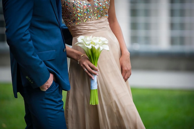 Beautiful wedding bouquet in hands of the bride