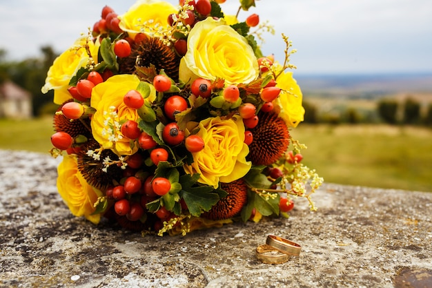 Beautiful wedding bouquet and rings. Wedding day. 