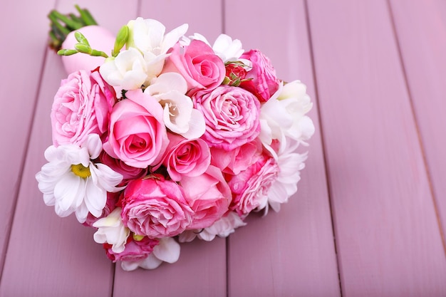 Beautiful wedding bouquet on wooden background