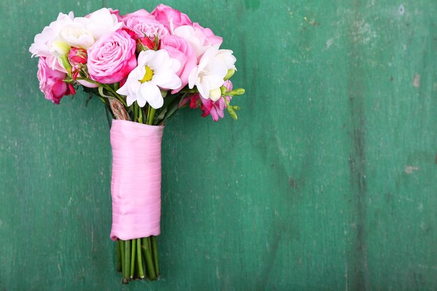 Beautiful wedding bouquet on wooden background