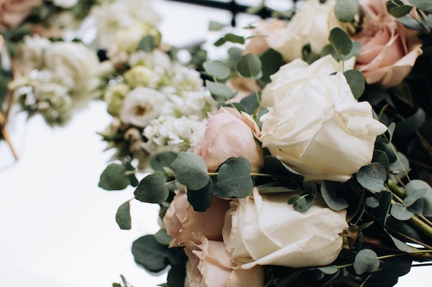 Beautiful wedding bouquets of beige roses for the bride Wedding accessories