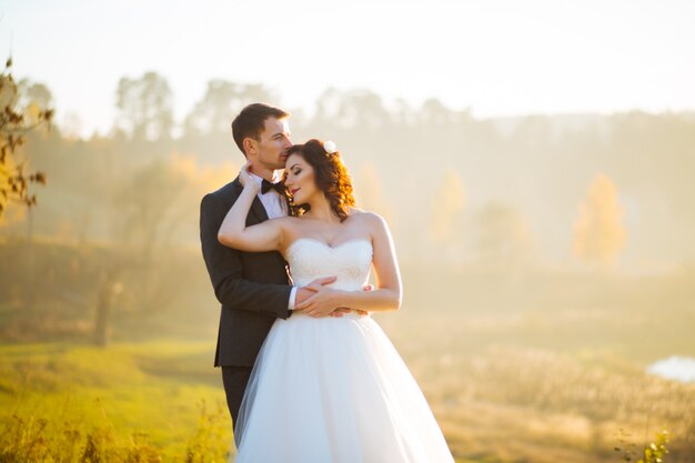 Beautiful wedding couple in nature