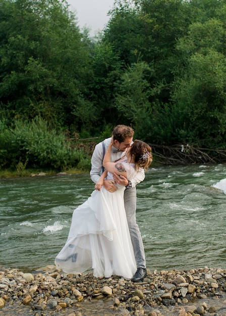 Beautiful wedding couple posing in nature