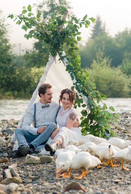 Beautiful wedding couple posing in nature