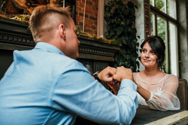 Beautiful wedding couple posing in a restaurant