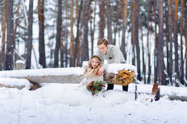 Beautiful wedding couple on their winter wedding