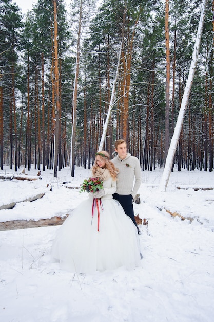 Beautiful wedding couple on their winter wedding