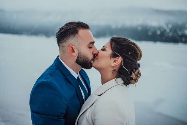 Beautiful wedding couple on their winter wedding