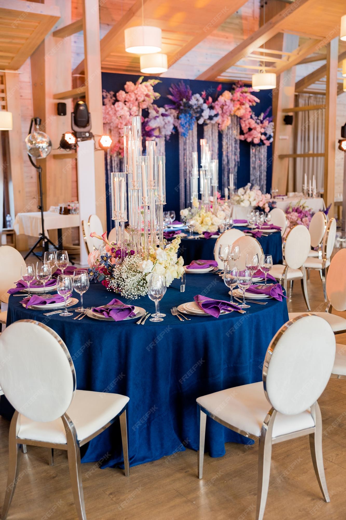 Premium Photo | Beautiful wedding decor in blue and purple tones wedding table decoration flowers plates glasses Premium Photo | Beautiful Wedding Decor In Blue And Purple Tones Wedding Table Decoration Flowers Plates Glasses