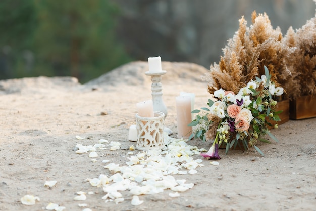 Beautiful wedding decor. Rose petals scattered on the ground