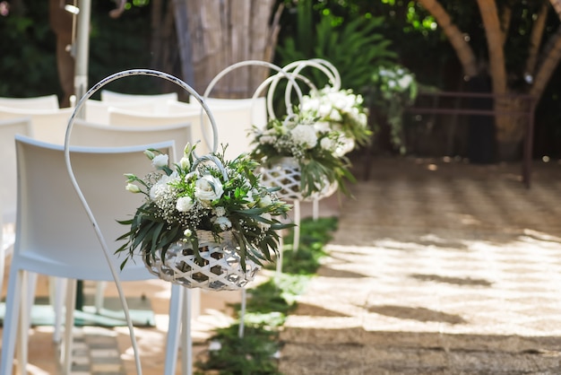 Beautiful Wedding Flower Arrangements Along the Aisle