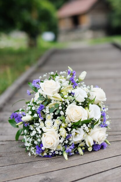 Beautiful wedding flowers bouquet on wooden path