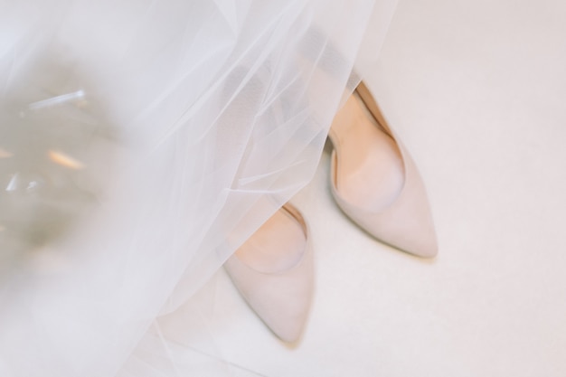 Beautiful wedding shoes of the bride.