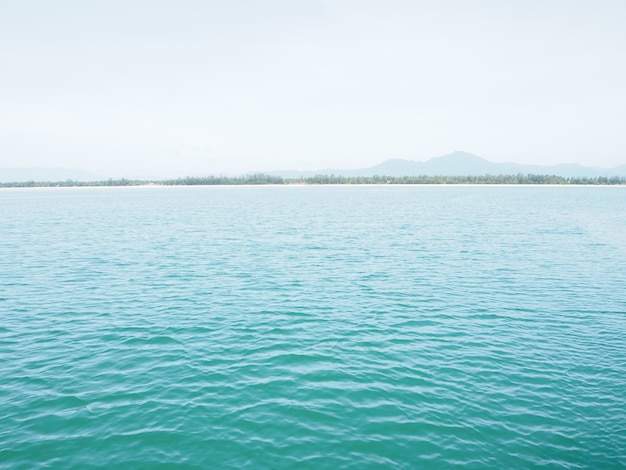 Beautiful white clouds on blue sky over calm sea