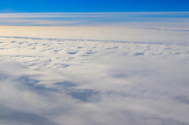 Beautiful white clouds in blue sky view from airplane