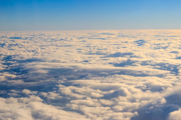 Beautiful white clouds in blue sky View from airplane