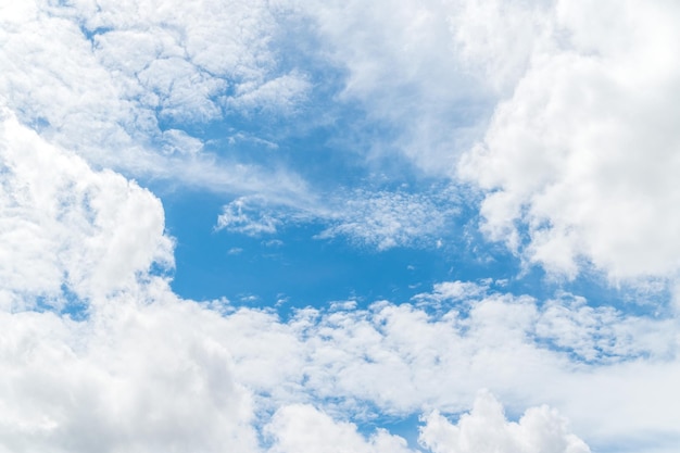 Beautiful white fluffy clouds in blue sky Nature background from white clouds in sunny day