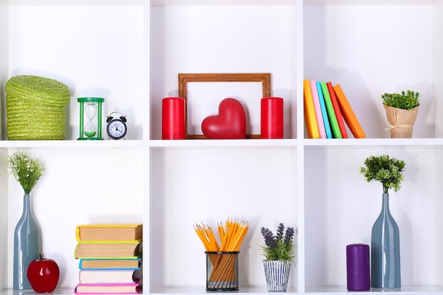 Beautiful white shelves with different home related objects