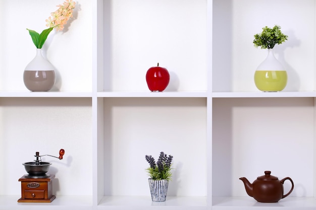 Beautiful white shelves with different home related objects