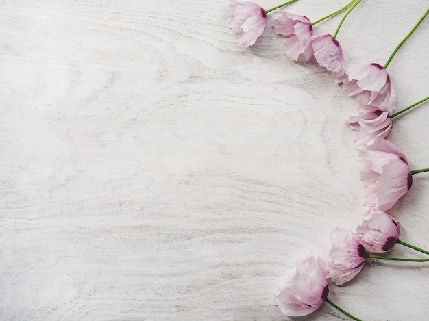 Beautiful wildflowers lying on a wooden table