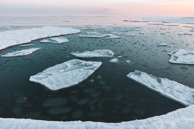 Beautiful winter sea landscape with floating ice fragments 
