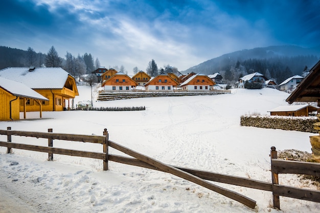 Beautiful winter view of farm on mountain at Austrian town