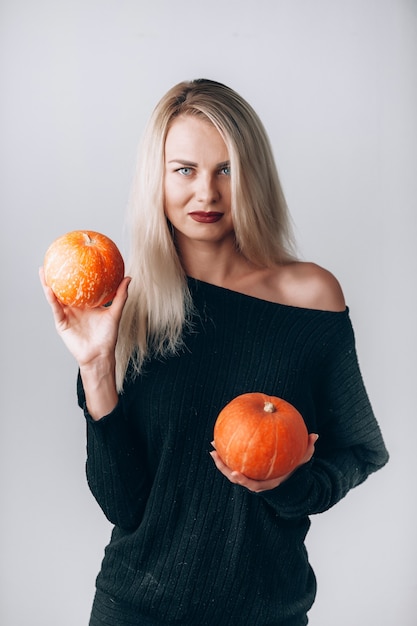 Beautiful witch with pumpkins