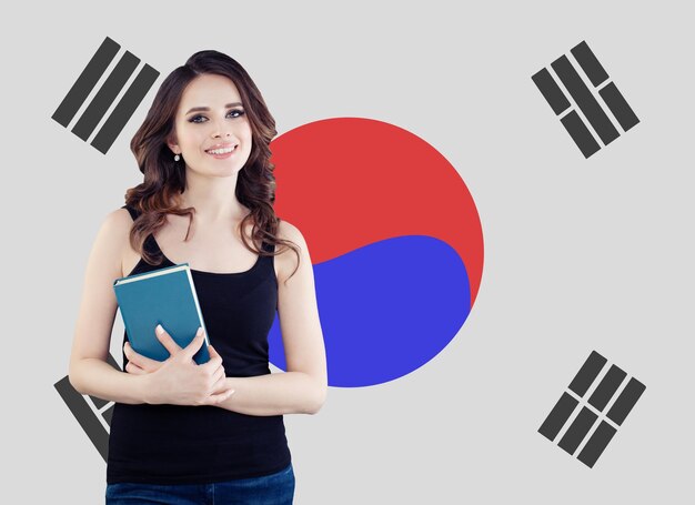 Beautiful woman against the Republic of Korea flag background Travel study and work in South Korea