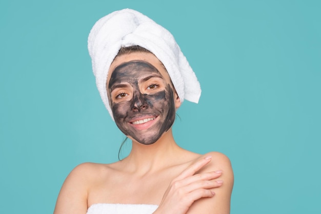 Beautiful woman applying facial mask mud facial mask face clay mask spa beautiful woman with cosmeti