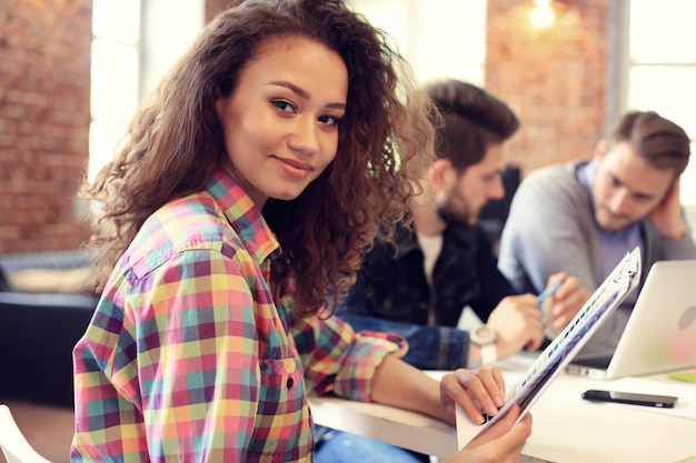 Beautiful woman on the background of business people