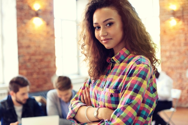 Beautiful woman on the background of business people