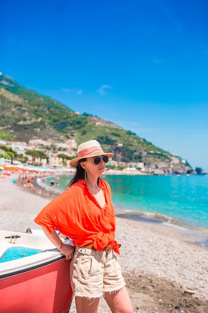 Beautiful woman on the beach on amalfi coast in italy