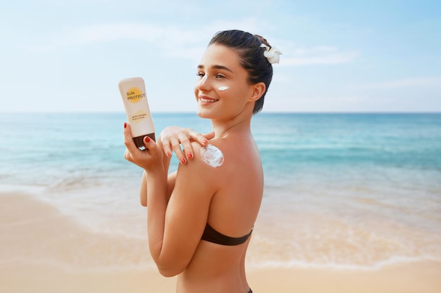 Beautiful Woman in Bikini Applying Sun Cream on Tanned Shoulder Sun Protection Skin and Body