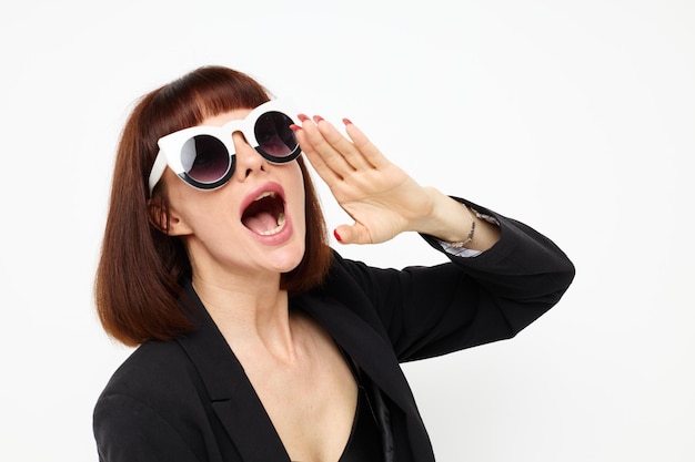 Beautiful woman in a black suit sunglasses luxury isolated background