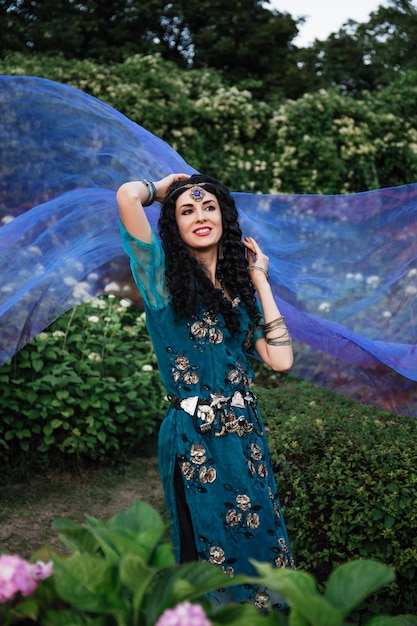 beautiful woman in a blue Indian sari dress