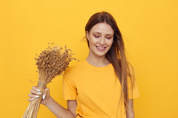 Beautiful woman bouquet of dried flowers casual wear smile posing Lifestyle unaltered