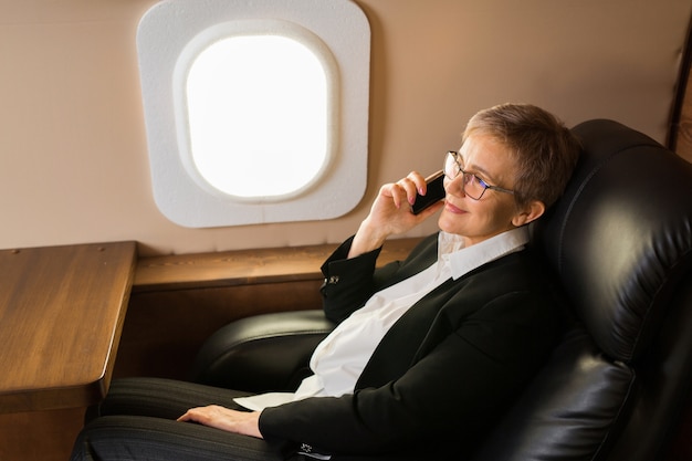 Beautiful woman in the cabin of a private jet