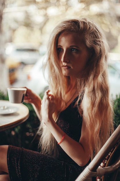 Beautiful woman in cafe street