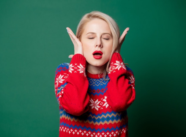 Beautiful woman in Christmas sweater  