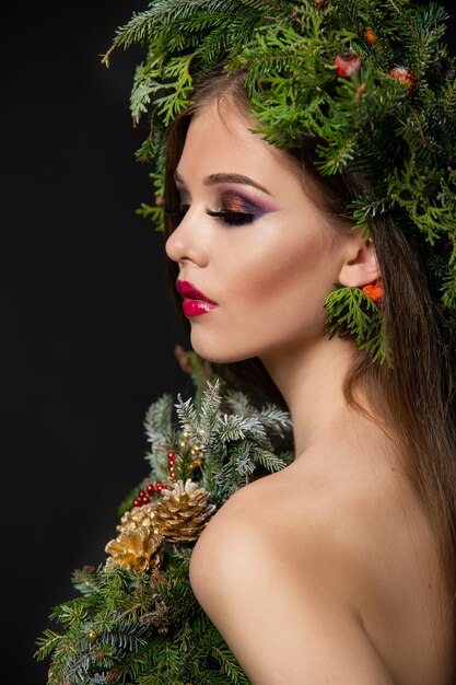 Beautiful woman in a Christmas wreath