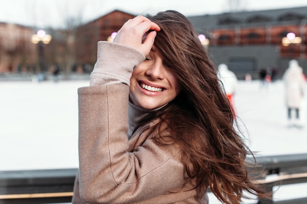 Beautiful woman closeup winter cold weather outdoor street portrait