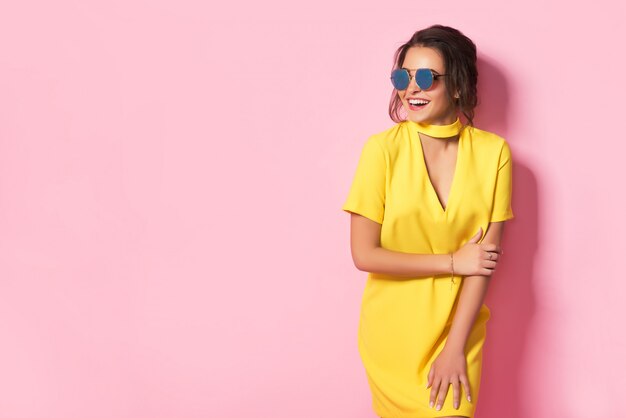 Beautiful woman in colorful clothes wearing sunglasses