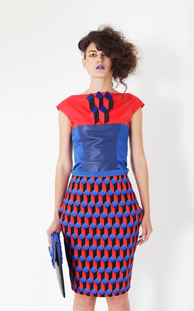 beautiful woman in an colorful dress with a clutch